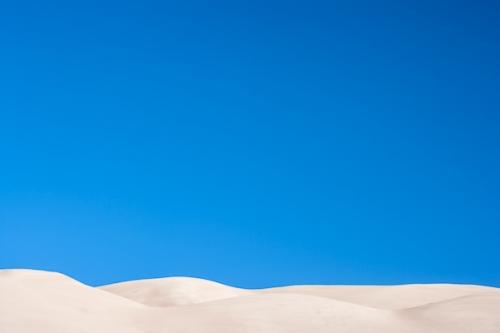 Abstract;Abstraction;Abstractions;Beige;Blue;Blues;Calm;Colorado;Cool Colors;Cool Palette;Cool Tones;Dune;Gold;Great Sand Dunes National Park and Preserve;Healing;Health care;Healthcare;Hill;Line;Minimalism;Mountain;Nature;Pastoral;Patterns;Sand;Shape;Stock categories;Sunlight;Sunshine;Tan;Textures;Warm Colors;Warm Palette;Warm Tones;blue;color;landscape;oneness;pattern;peaceful;restful;serene;shapes;sky;soothing;sunlit;taupe;tranquil;zen